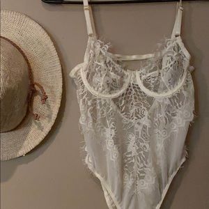 White lace bodysuit from Laura’s Boutique